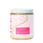 Scented candle jar with pink label on a white background