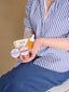 women holding mini face kit samples