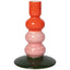Two-toned ceramic candle holder with orange and pink gradient on a white background