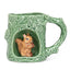 Green ceramic mug with a squirrel design on a white background