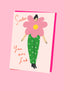 Greeting card with a stylized illustration of a person wearing a pink flower-shaped headpiece and green polka dot pants on a pink background.