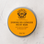 Jamaican Ginger Heat Rub container with orange label on a white background