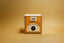 Tea infuser packaging with 'Bush Berry' branding on a beige background