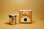 Tea infuser with packaging on a yellow background