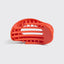 Orange hair clip on a light gray background