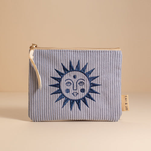 seafoam blue pouch with embroidery blue sun