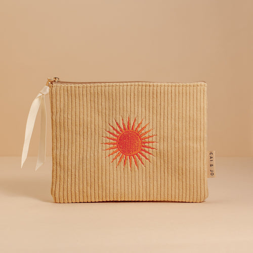 ochre pouch with orange embroidery sun