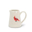 White ceramic pitcher with a red cardinal design on a white background