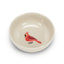 Small ceramic bowl with a red cardinal design on a white background