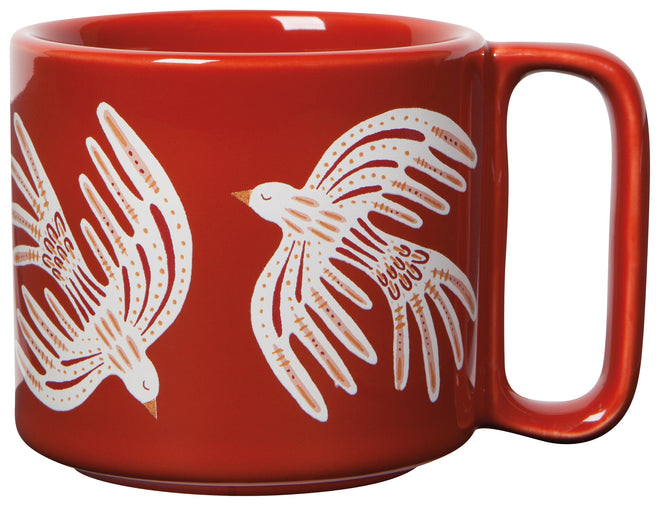 whitle bird design on orange mug