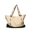 Beige tote bag with 'aide' text on handles and green bottom section against a white background