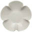 White ceramic flower-shaped plate on a white background