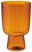 Orange glass cup on a white background