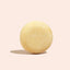 Yellow ball on a beige background