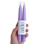 hand holding purple candles 