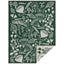 Green towel with white forest-themed pattern on a white background