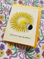 Card with sun illustration and 'You are my sunshine' text on a floral background