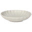 White ceramic bowl with scalloped edge on a white background