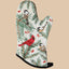 Oven mitt with winter-themed design featuring birds and evergreen branches on a white background