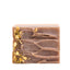 Bar of soap with gold leaf on a white background