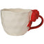 White mug with a red handle on a white background