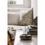 Marble incense holder with a single incense stick on a coffee table in a living room.