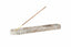 Decorative incense holder with a single incense stick on a white background