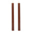 Two tall, ribbed brown candles on a white background