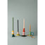 Set of colorful candle holders with candles on a gray background