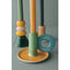 Colorful ceramic holder with various shaped ceramic pieces on a gray background