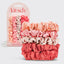 Set of pink satin scrunchies with packaging labeled 'kitsch' on a light gray background.