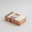 Decorative box with floral design on a light gray background