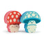 Two cartoonish mushroom characters with red and blue caps on a white background