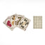 Floral-patterned playing cards with a checkered mat on a white background