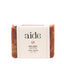 Bar of soap with 'aide' branding on a white background
