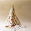 Floral-patterned fabric hanging against a beige background