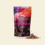Packaging of GNAW Hot Chocolate Flakes Smooth Milk on a beige background