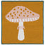 Knitted mushroom design on a square patch with a green border.
