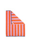 Striped towel with orange and pink pattern on a white background