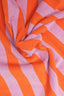 Close-up of fabric with orange and pink vertical stripes