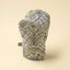 Fabric-wrapped object with leaf pattern on a beige background