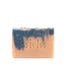 Bar of soap with blue and beige swirls and 'aide' branding on a white background