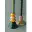 Two decorative candle holders with colorful ceramic bases on a gray background