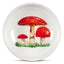 Round ceramic plate with red mushroom design on a white background