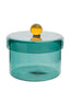 Teal glass jar with a yellow lid on a white background