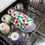 Dishwasher with a strawberry-patterned towel among other dishes
