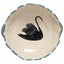 Beige plate with a black swan design on a white background