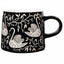 Black mug with white swan pattern on a white background
