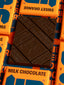 Dark chocolate bar with 'B&G' branding on a background of orange and blue packaging.