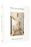 Book titled 'The Art of Home' by Shea McGee with a cover photo of a woman in a home.